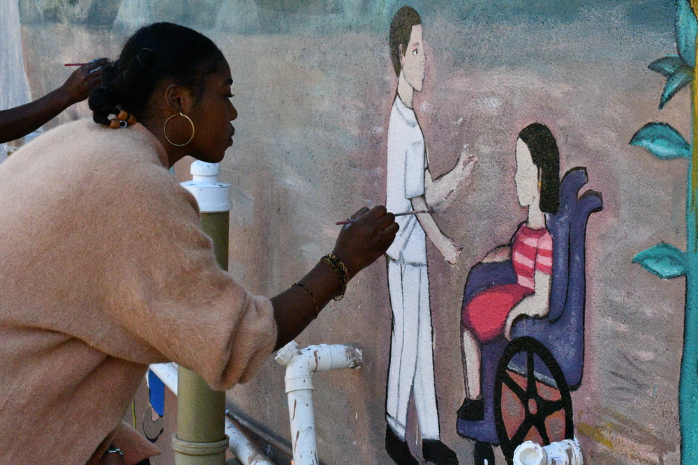The community of refugees painted a mural on the Baobab House Wellness Centre wall. © MSF/Dorothy Meki
