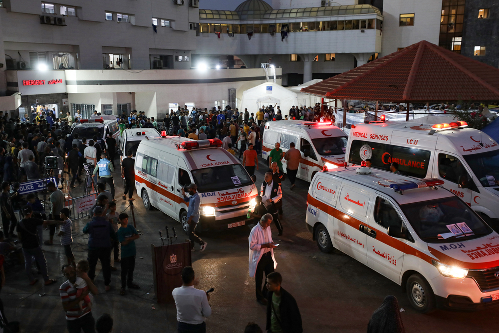 Ambulances carrying victims crowd the entrance to the emergency ward of the Al-Shifa hospital in Gaza City