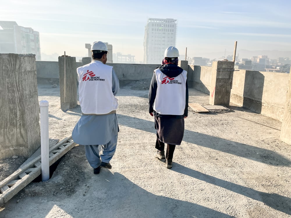 MSF construction team walk on the roof of a new building in Khost Maternity Hospital