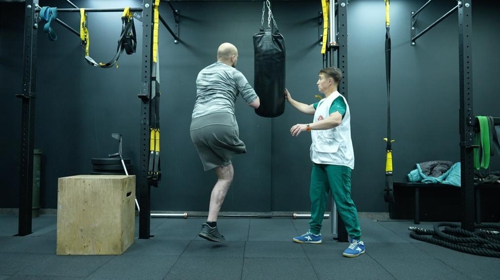 Patient in rehabilitation with physiotherapist