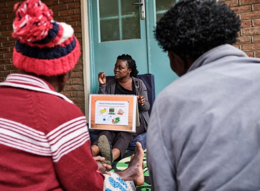 A MSF Health promotion officer, leads a group session with patients undergoing palliative treatment