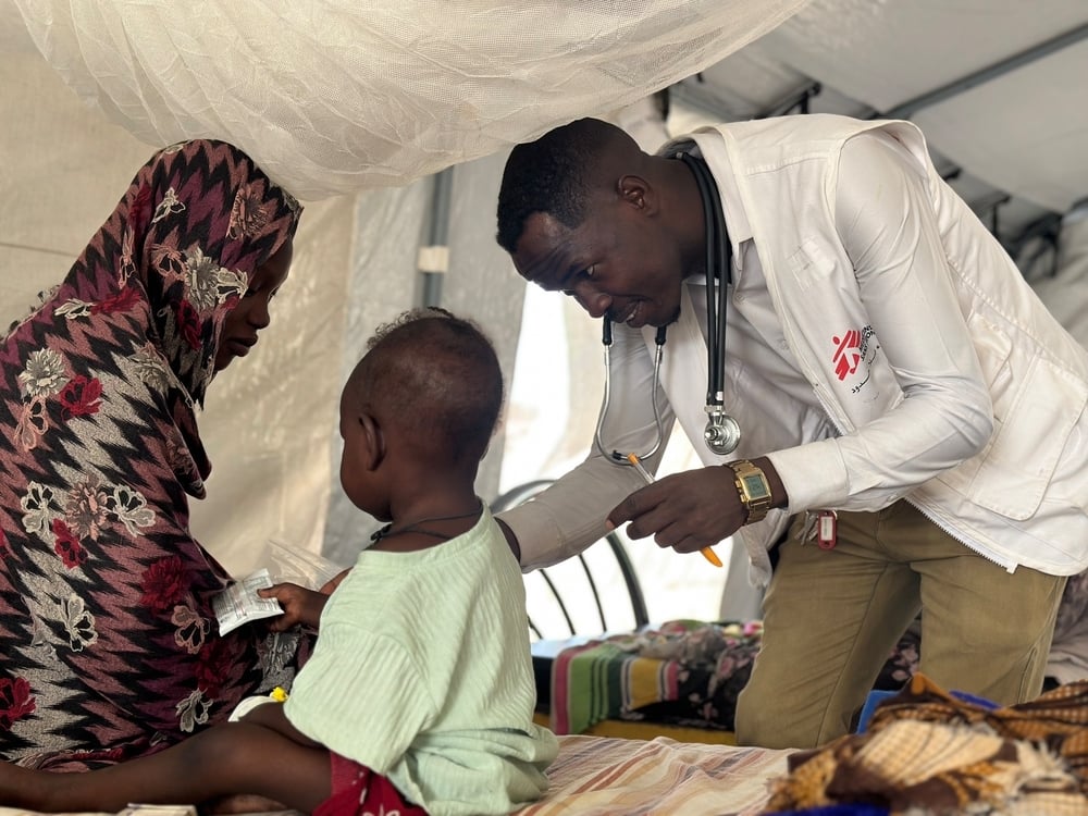 Doctor examines child