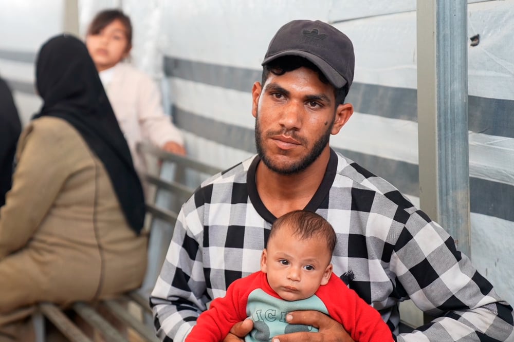 Mahmoud with his infant son