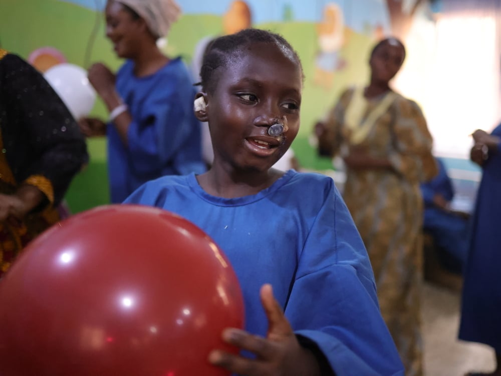 Maryam playing with a balloon