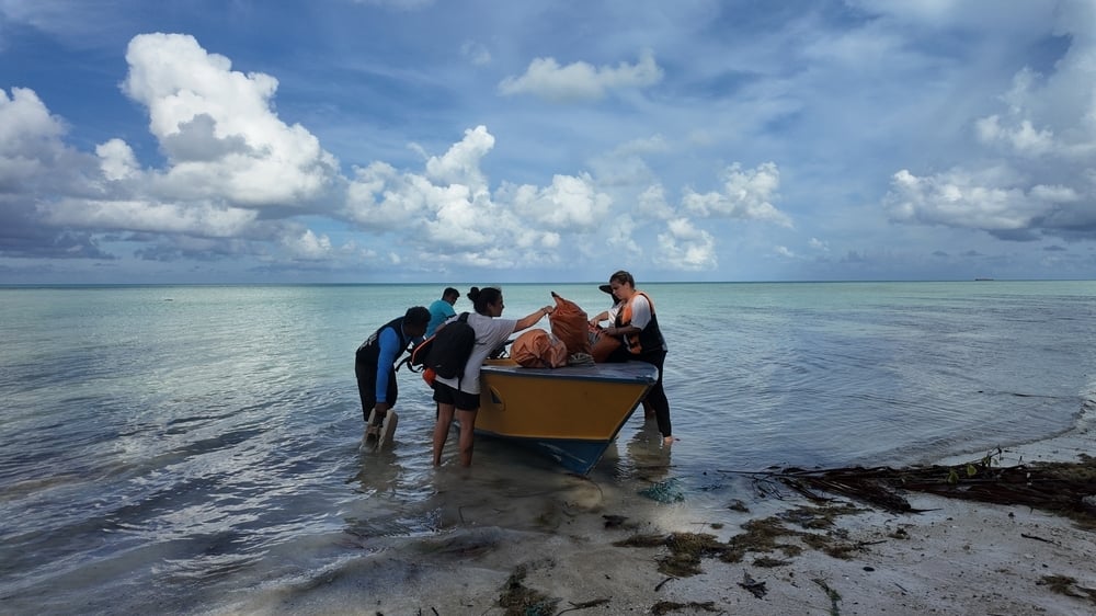 MSF WASH team with a boat