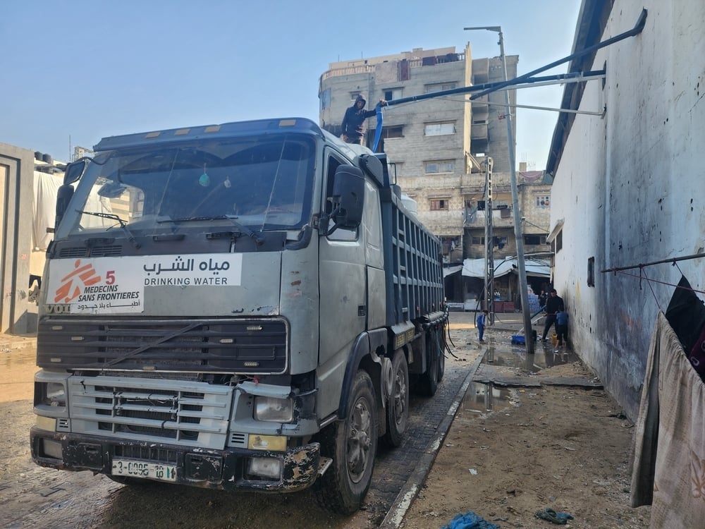 A truck carrying water tanks