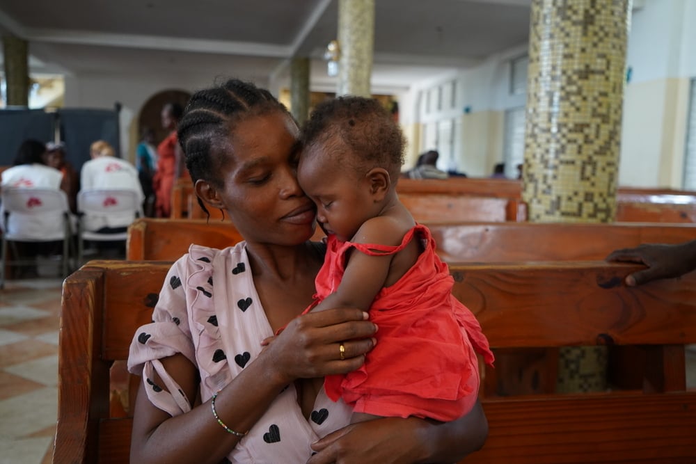 Minise with her five-month-old daughter