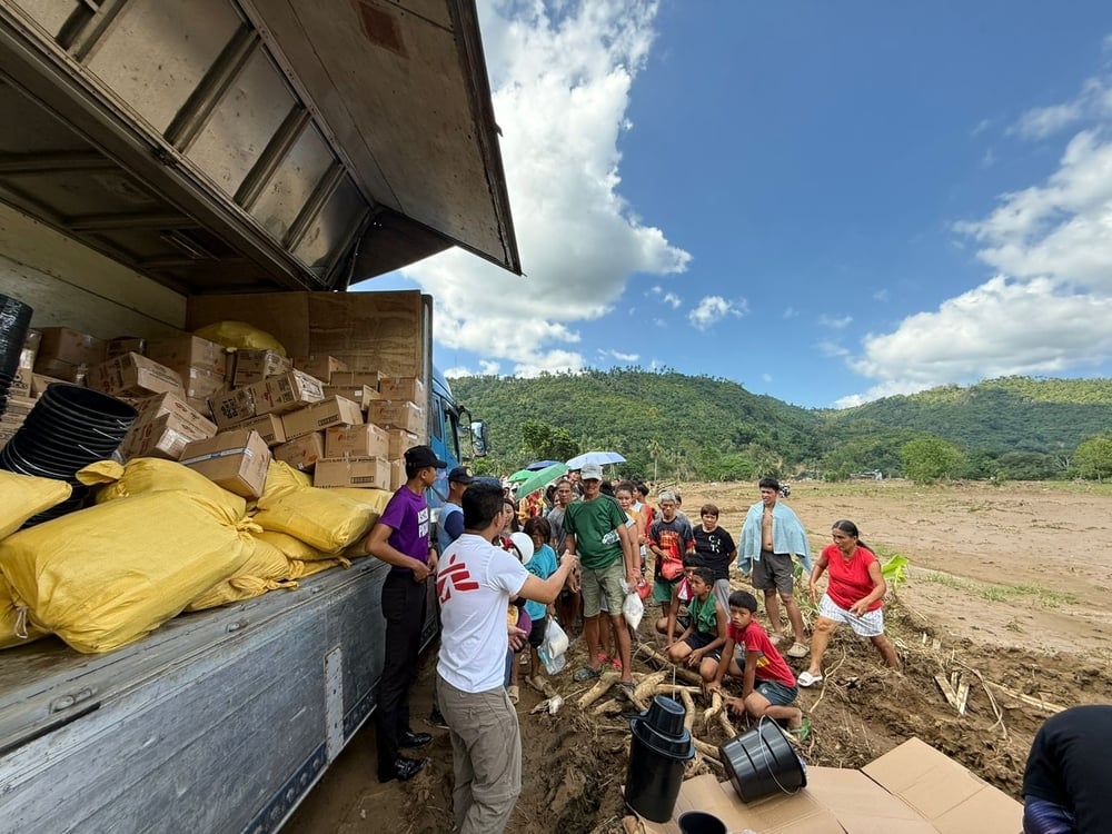 MSF Staff distributing non-food item (NFI) kits to communities impacted by the typhoon Kalmaegi in the Philippines and subsequent flooding
