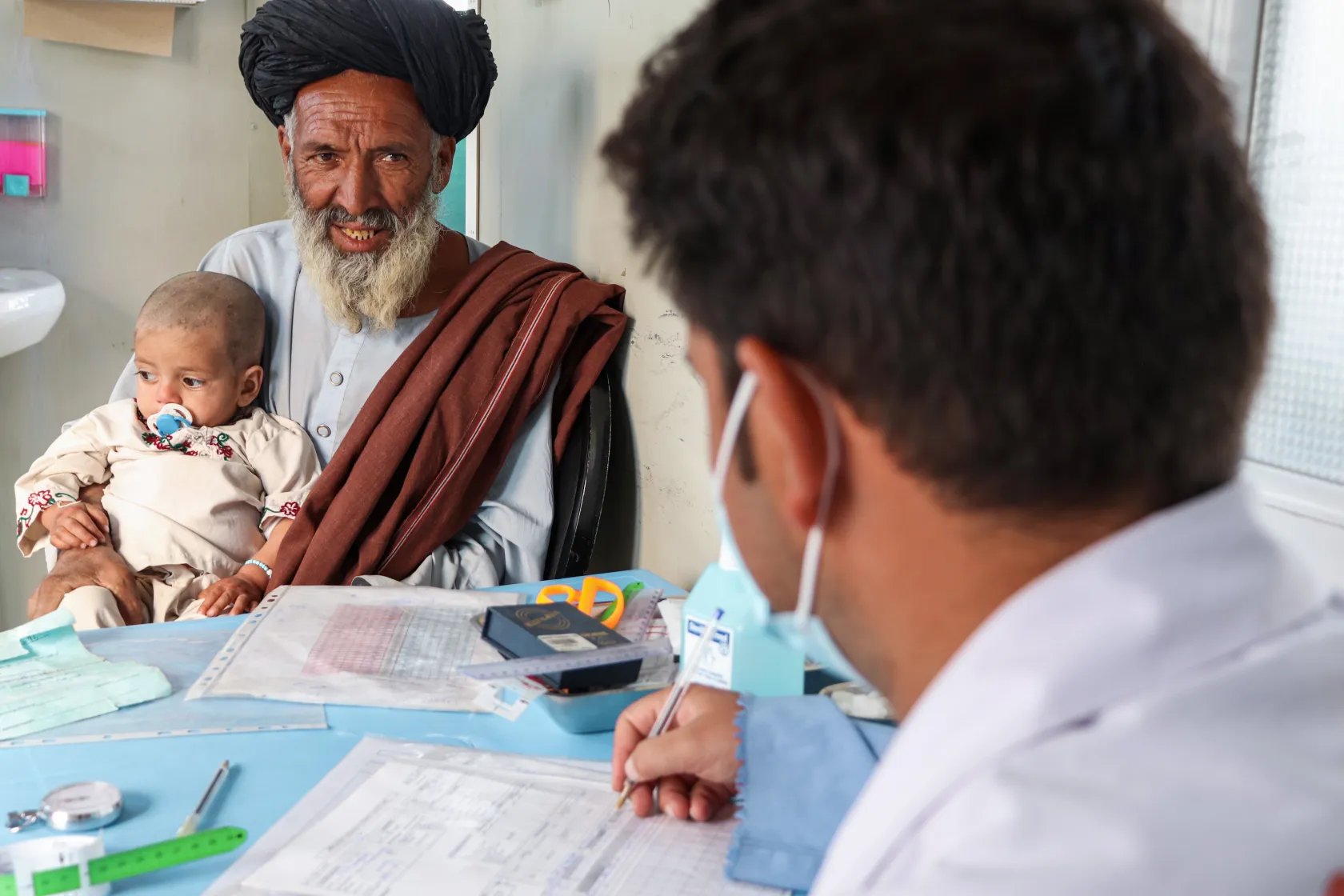 medical consultation in MSF’s therapeutic feeding program in Kandahar
