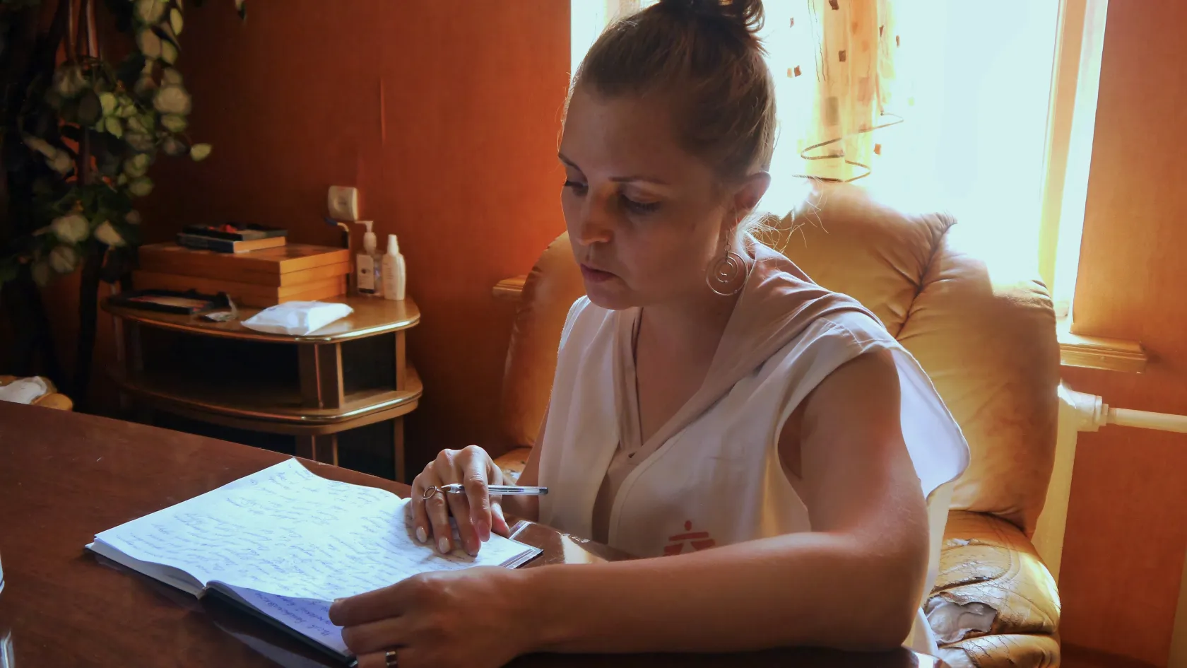  MSF health promotion supervisor, reviewing notes from meetings with patients