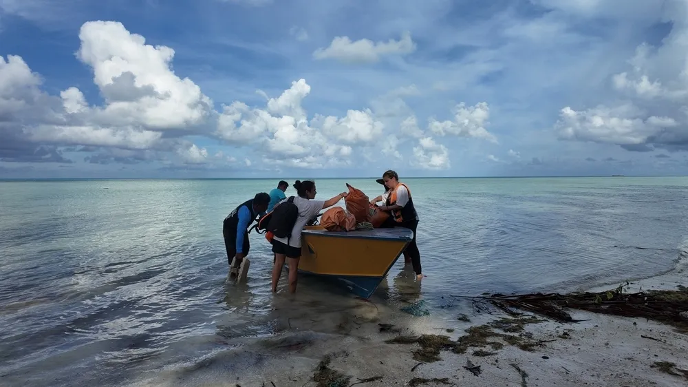 MSF WASH team with a boat