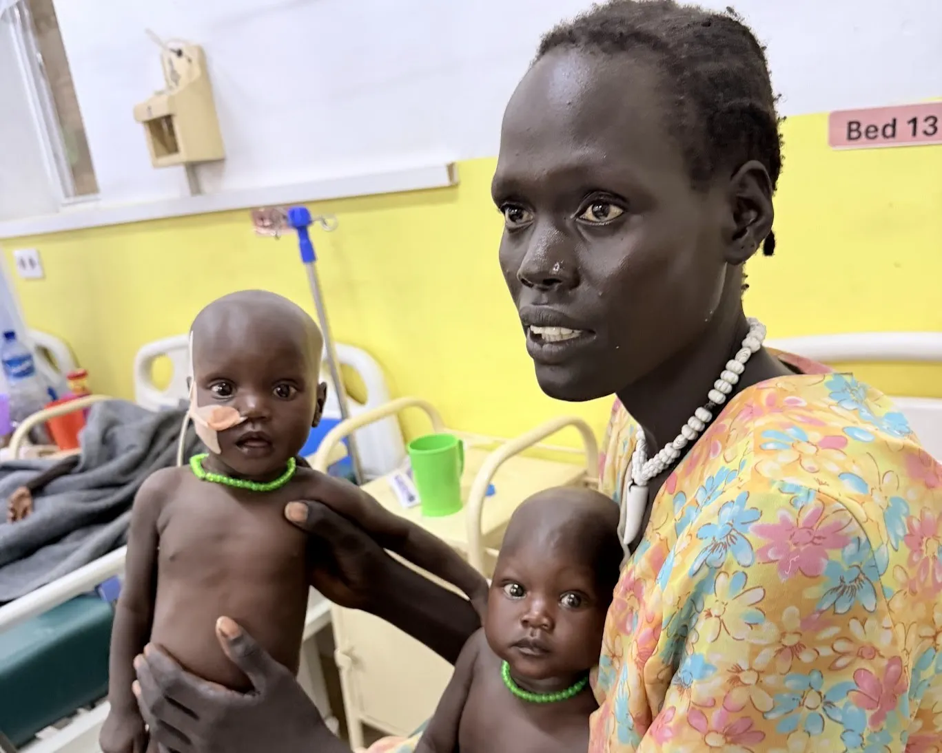 Akok Wol Manyuol with her twins