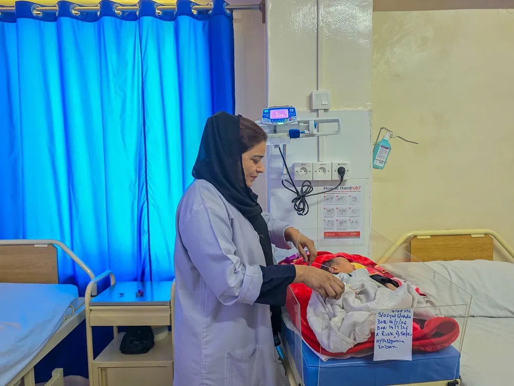 An MSF nurse cares for a newborn baby