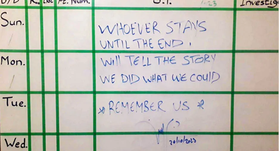 A message on a board at Al-Awda Hospital in northern Gaza, following a strike that killed three doctors