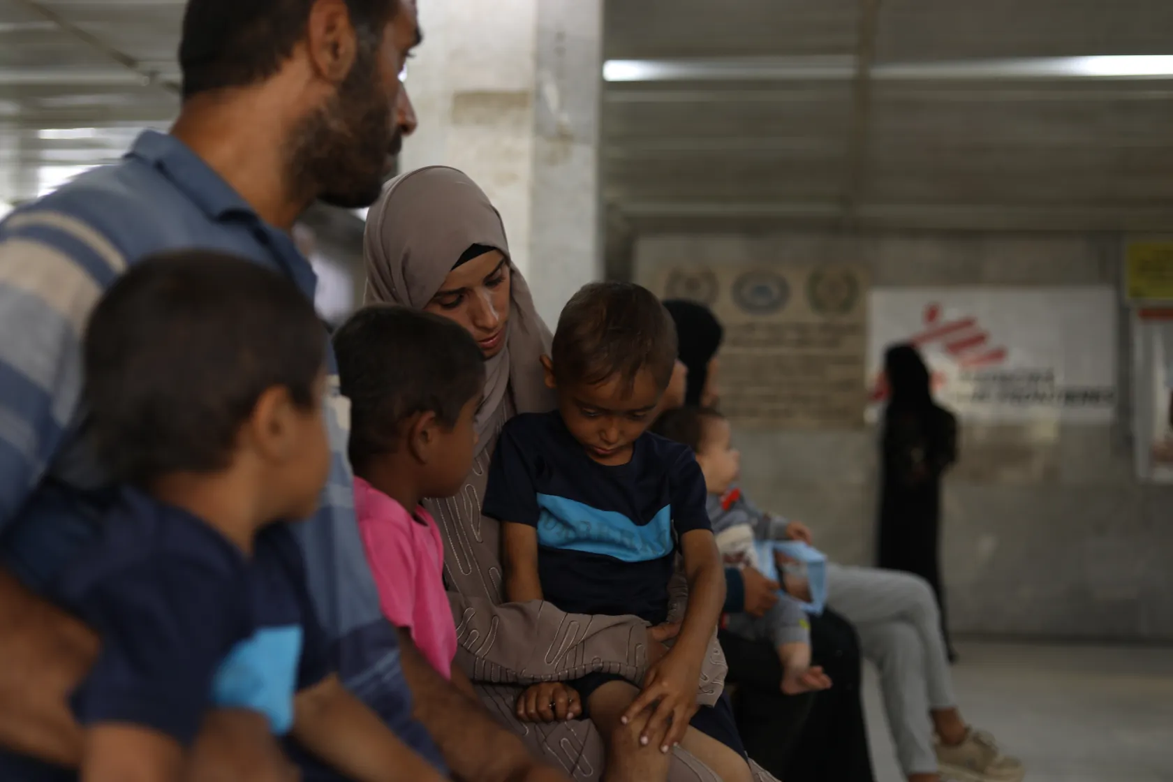 Hanan Zanoun cares for her three children, Qasem, 7, Abdallah, 5, and Mohammed, 3. They suffer from cystic fibrosis, coeliac disease, and heart conditions, which are compounded by malnourishment and a lack of medicine. She has already lost one daughter to the same conditions. © Nour Alsaqqa/MSF