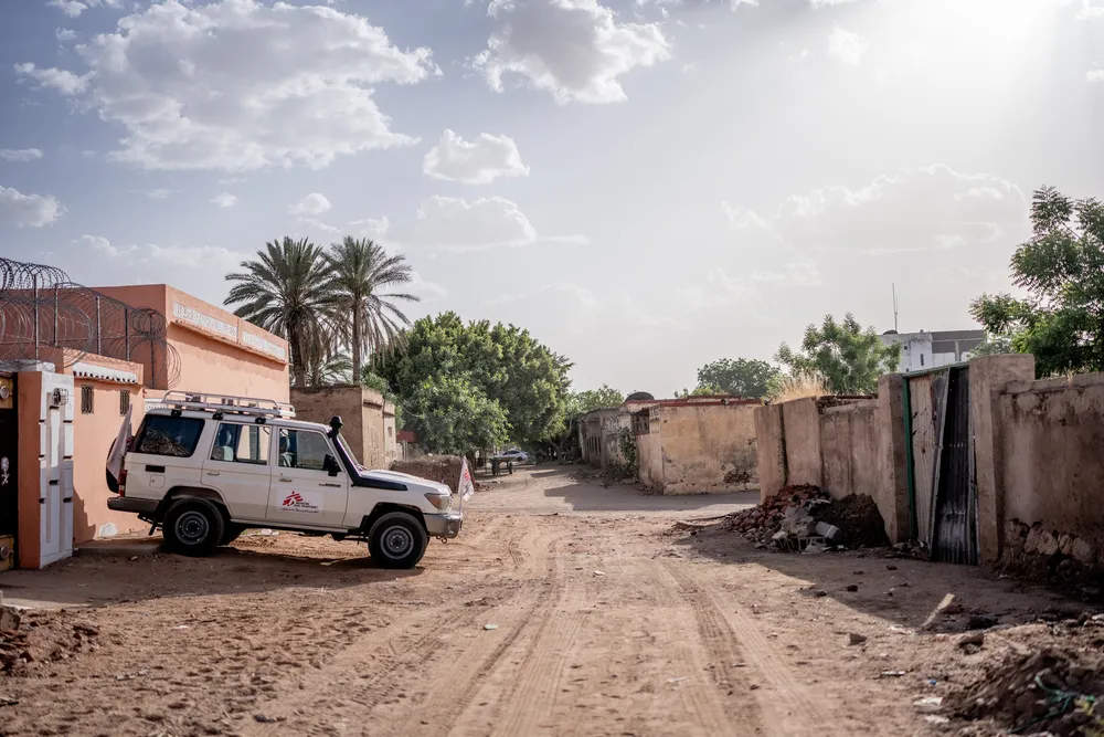 An MSF car is parked in front of the MSF office in Nyala