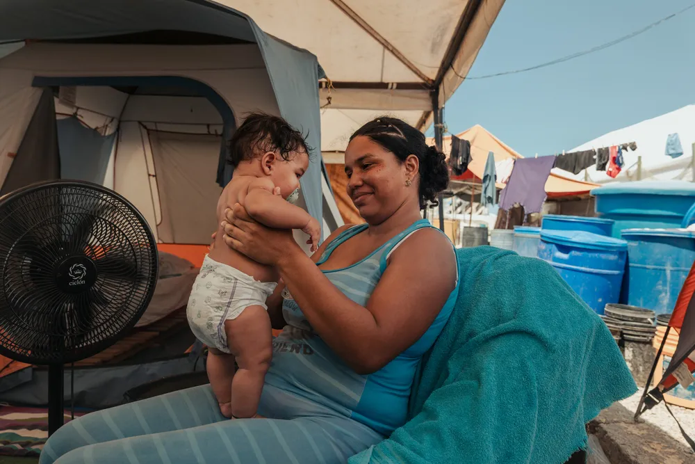 Greydiel Álvarez, 22, holds her three-month-old son