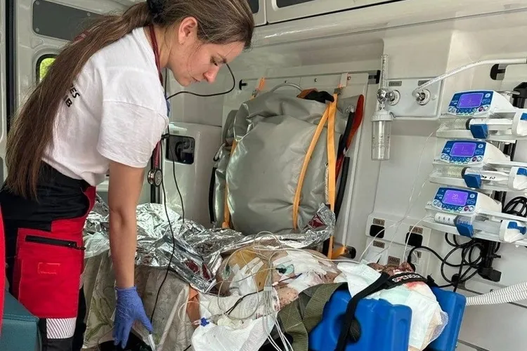 Paramedic cares for wounded person