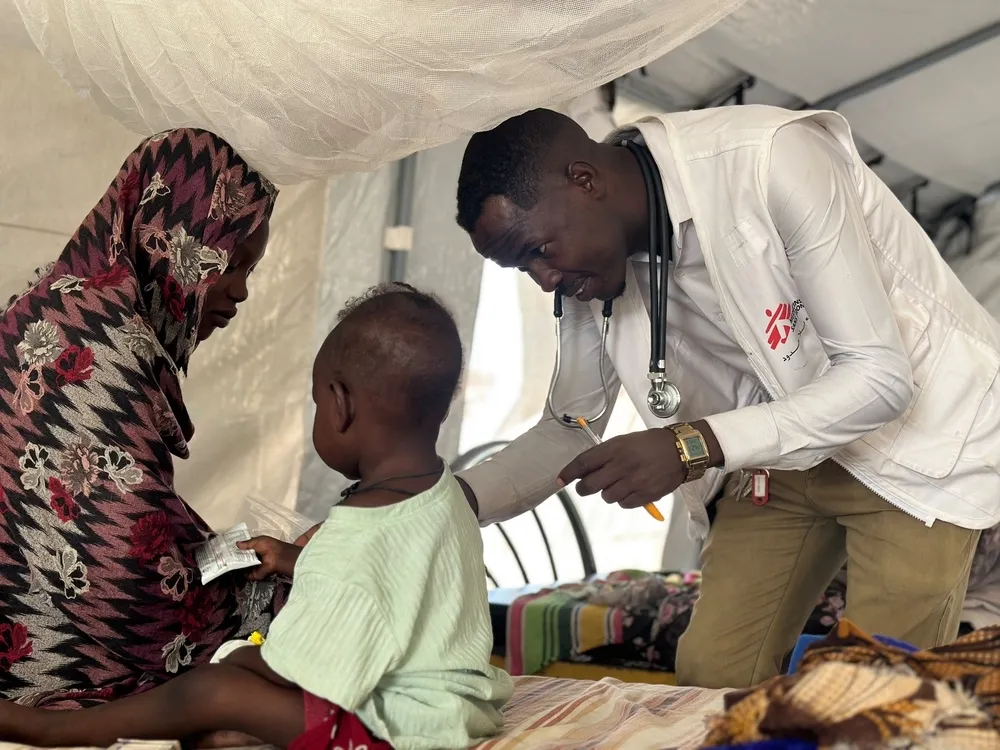 Doctor examines child