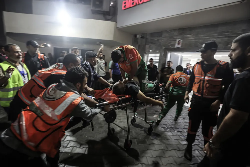 16 October 2023 - A Palestinian civil defence officer injured in Israeli attacks is given CPR