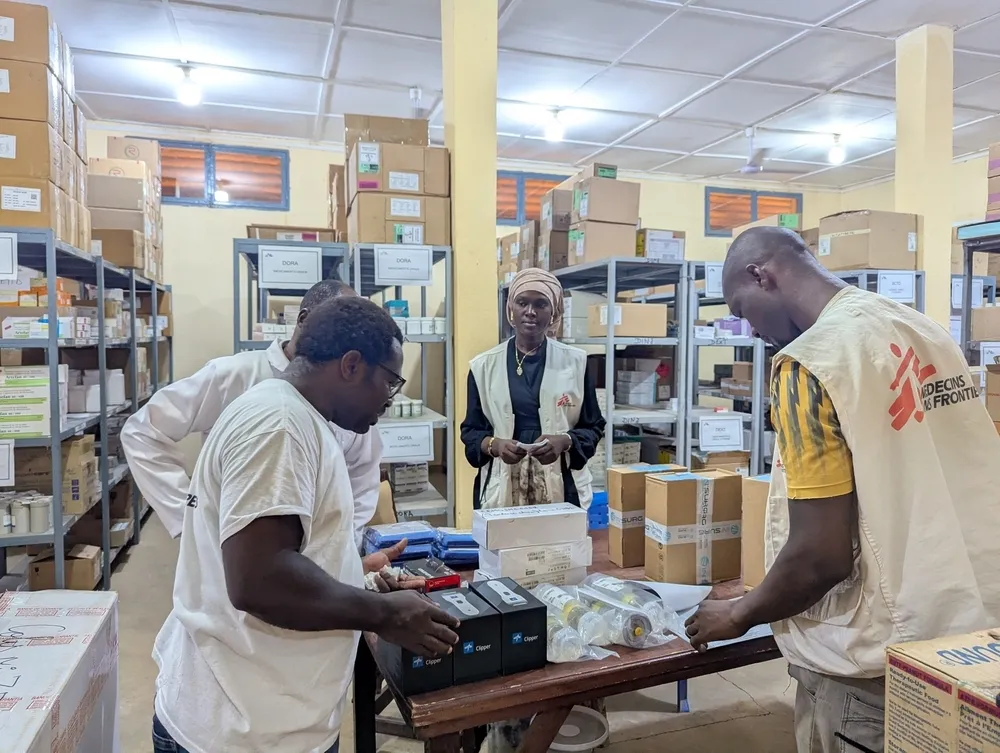 Moise Kitété, on the left, head of MSF’s medical operations, oversees the pharmacy at the MSF-supported project in Douentza