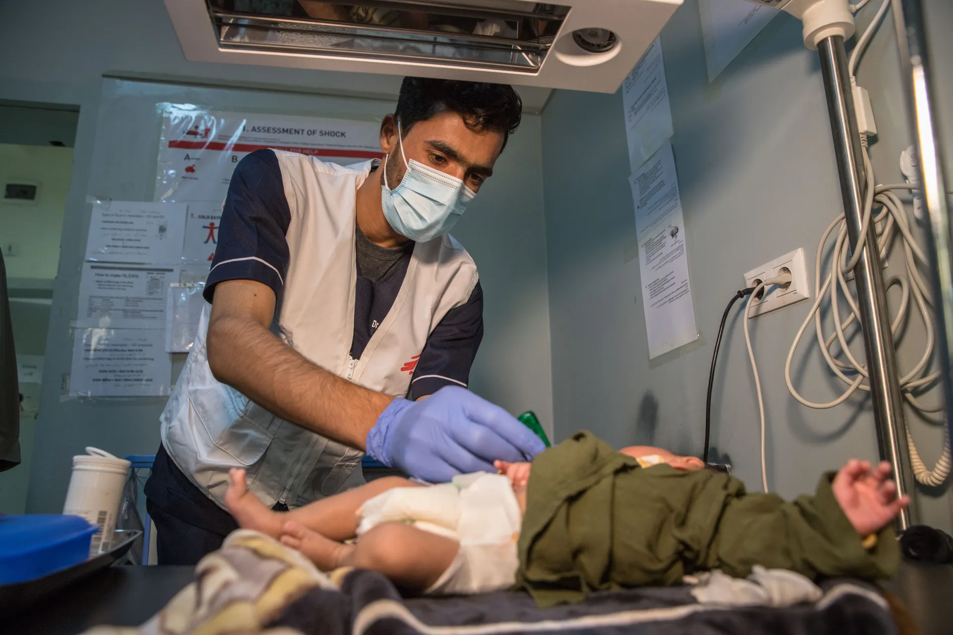 Baby being examined by MSF nurse