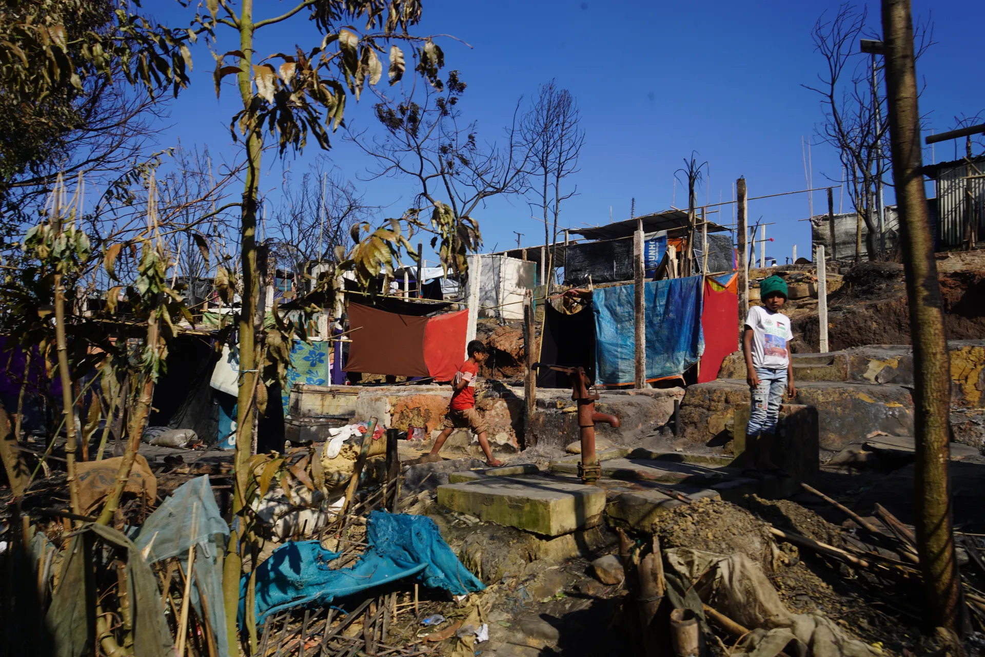 Children walking in Camp 5 after fires, Bangladesh
