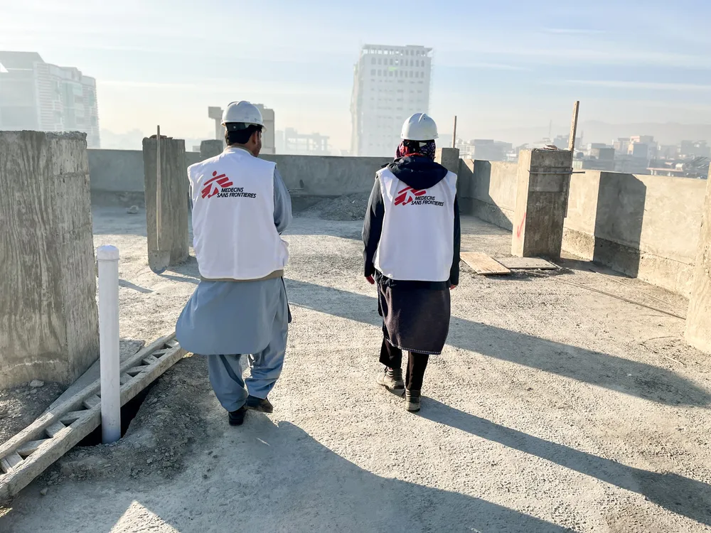 MSF construction team walk on the roof of a new building in Khost Maternity Hospital