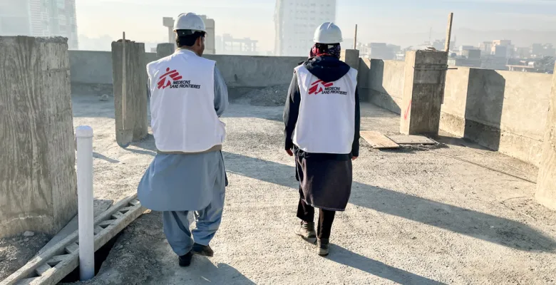 MSF construction team walk on the roof of a new building in Khost Maternity Hospital