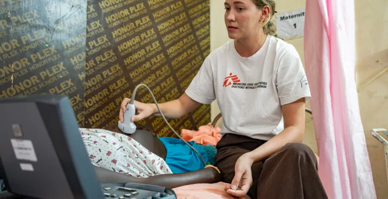 Midwife doing an ultrasound to a maternity patient